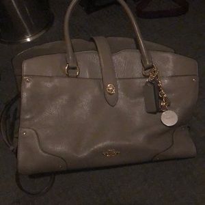 Grey leather coach purse.